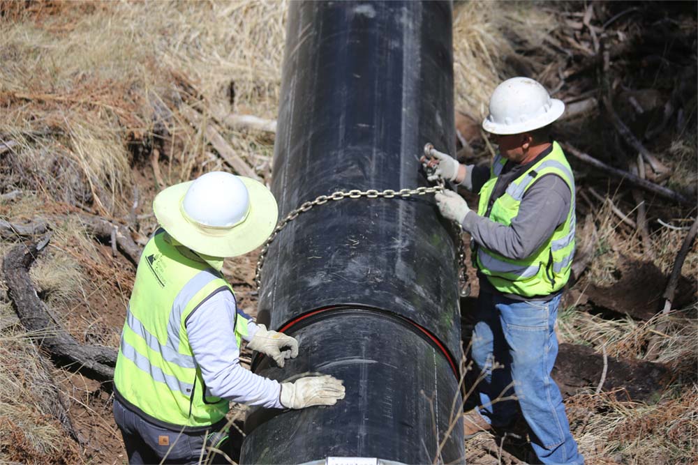 wrapping a chain around a large HDPE pipe