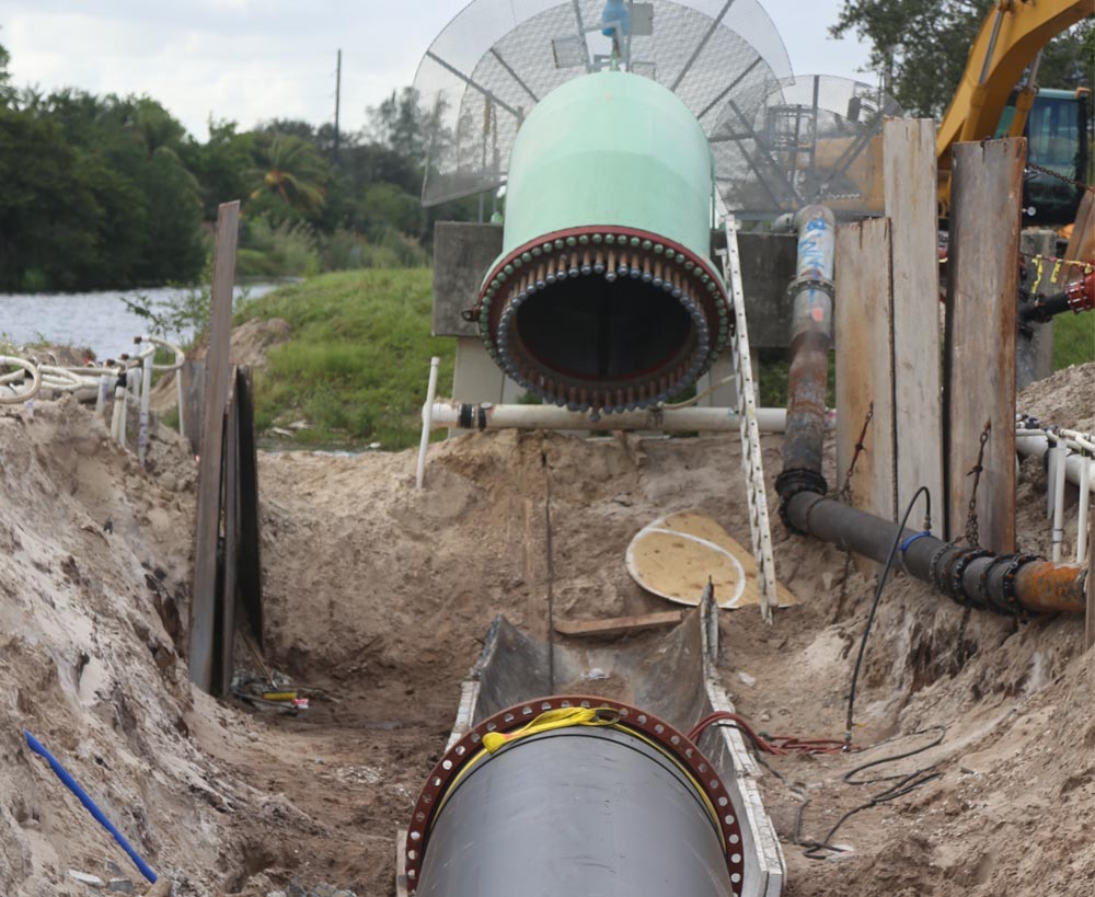 Installation of large HDPE pipe being at a wastewater treatment facility